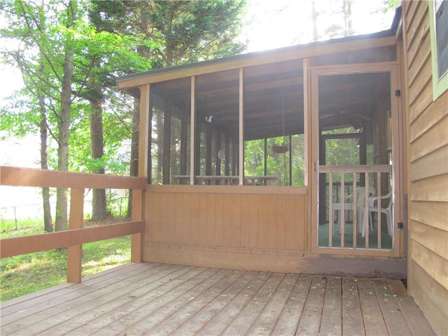 deck with a sunroom
