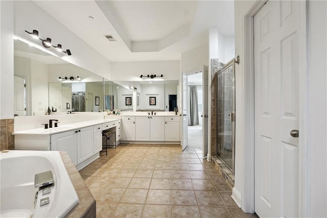 bathroom with separate shower and tub, tile patterned floors, and vanity