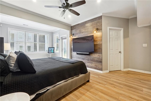 bedroom featuring light wood-type flooring, ceiling fan, and ornamental molding