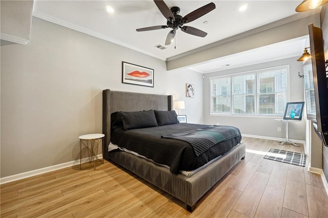 bedroom featuring light hardwood / wood-style floors, ceiling fan, and ornamental molding