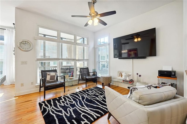 living room with ceiling fan and hardwood / wood-style floors