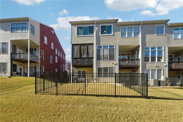 exterior space with a lawn and central air condition unit