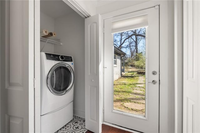 laundry room featuring washer / clothes dryer and laundry area