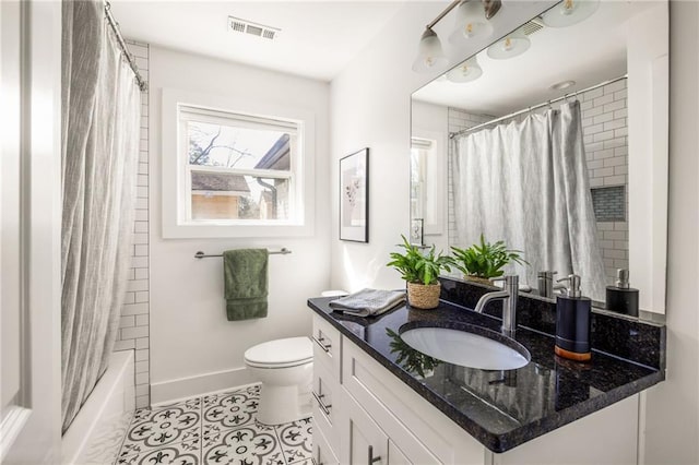 full bath featuring tile patterned flooring, visible vents, baseboards, toilet, and vanity