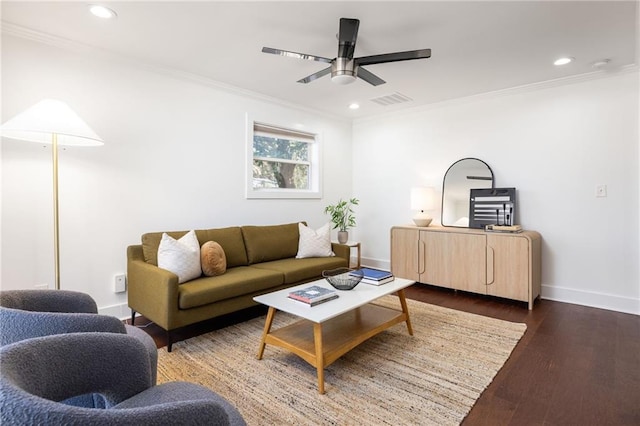 living area featuring dark wood finished floors, crown molding, baseboards, and visible vents