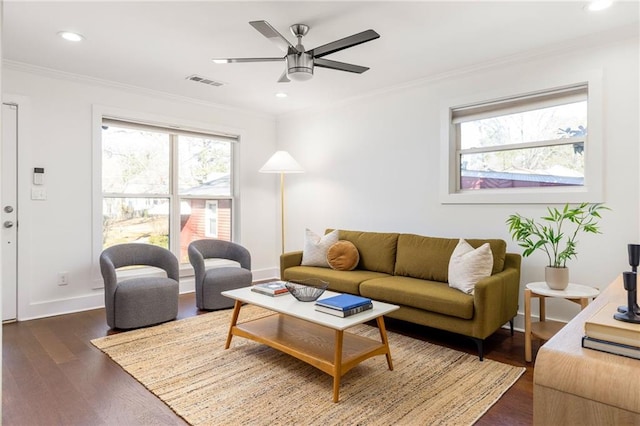 living room featuring visible vents, ornamental molding, recessed lighting, dark wood-style floors, and a ceiling fan