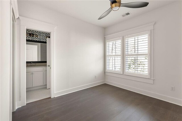 bathroom with walk in shower, vanity, and toilet