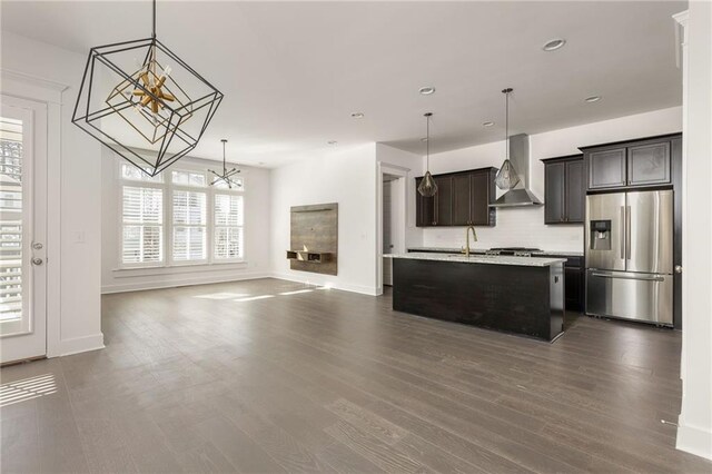 living room with an inviting chandelier and light hardwood / wood-style flooring