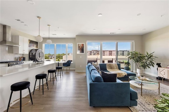 22 Airline St NE Unit 403, Atlanta, GA 30312 - living room featuring plenty of natural light, baseboards, light wood-style floors, and recessed lighting
