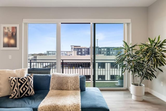 living area featuring wood finished floors and baseboards