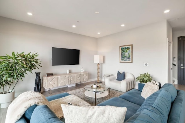 living room with recessed lighting, wood finished floors, and baseboards