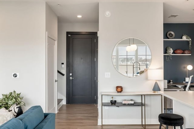 foyer with hardwood / wood-style flooring