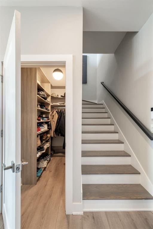 stairway with wood finished floors