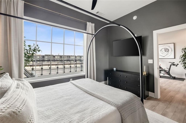 22 Airline St NE Unit 403, Atlanta, GA 30312 - bedroom with wood finished floors, baseboards, and a ceiling fan