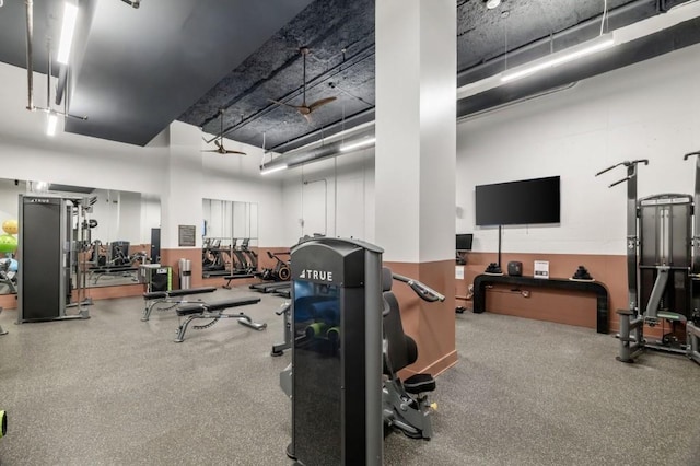 gym with a towering ceiling