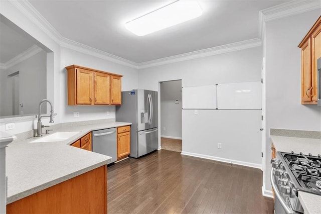 kitchen featuring a sink, stainless steel appliances, dark wood-type flooring, light countertops, and ornamental molding