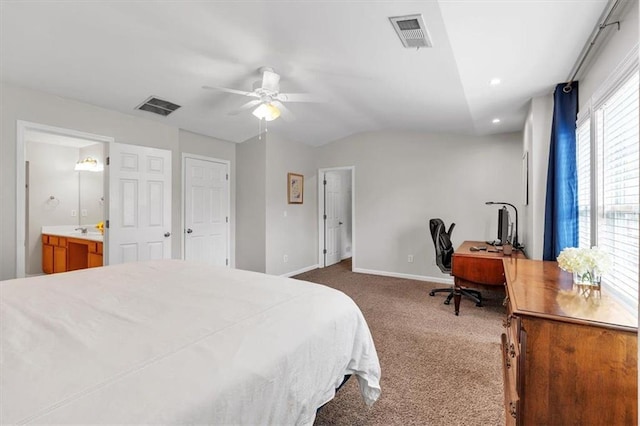 bedroom featuring vaulted ceiling, visible vents, baseboards, and carpet floors