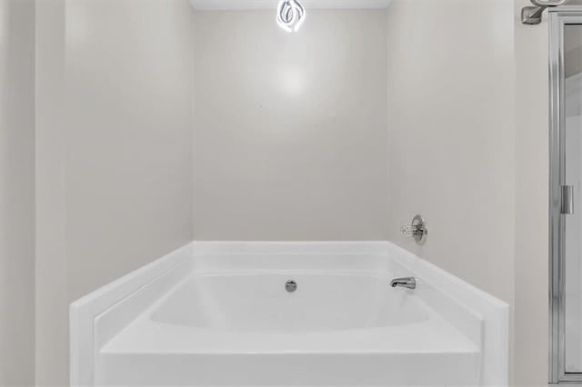 full bathroom featuring a garden tub