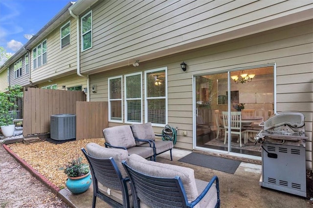 view of patio with an outdoor living space, cooling unit, area for grilling, and fence
