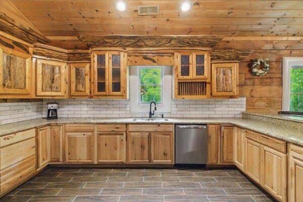 230 Old Mill White Ext, Jasper, GA 30143 - kitchen with a sink, stainless steel dishwasher, decorative backsplash, glass insert cabinets, and wooden ceiling