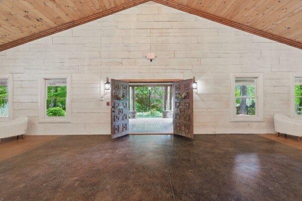 230 Old Mill White Ext, Jasper, GA 30143 - unfurnished living room with lofted ceiling, wooden ceiling, and healthy amount of natural light