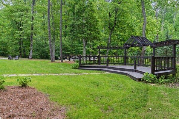 230 Old Mill White Ext, Jasper, GA 30143 - surrounding community featuring a lawn, a deck, and a forest view