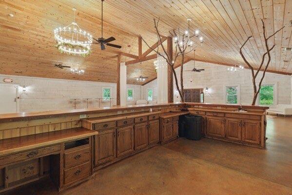 230 Old Mill White Ext, Jasper, GA 30143 - kitchen featuring wooden ceiling, brown cabinetry, a ceiling fan, lofted ceiling, and a chandelier