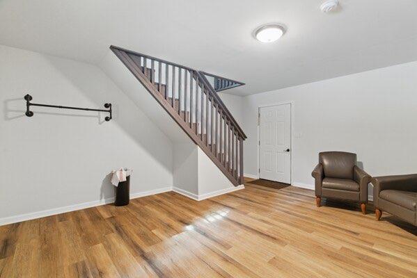 230 Old Mill White Ext, Jasper, GA 30143 - unfurnished room with stairs, wood finished floors, and baseboards