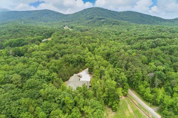 230 Old Mill White Ext, Jasper, GA 30143 - aerial view of property and surrounding area with a heavily wooded area and a mountain backdrop