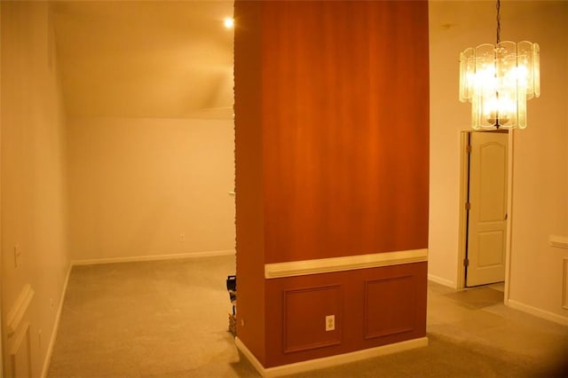 bonus room featuring vaulted ceiling, light colored carpet, and an inviting chandelier