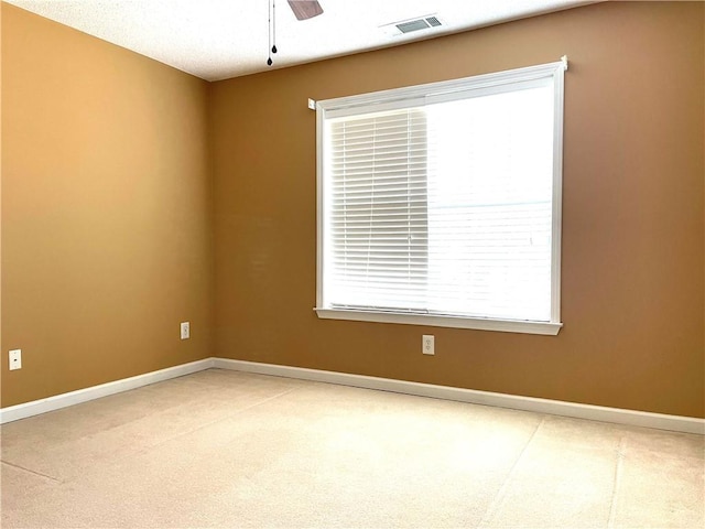 unfurnished room featuring ceiling fan