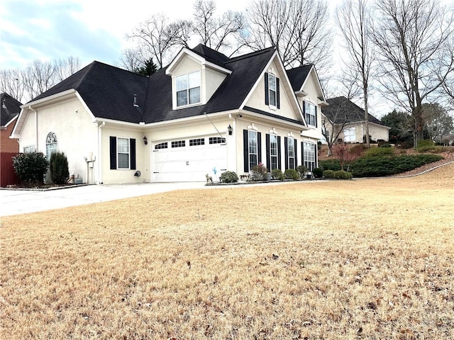 view of front of home with a garage and a front yard