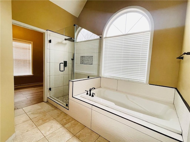 bathroom featuring shower with separate bathtub and tile patterned floors