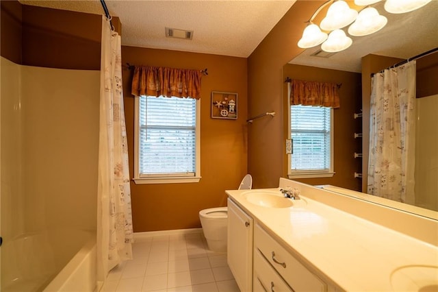 full bathroom featuring vanity, toilet, shower / bath combo, tile patterned floors, and a textured ceiling