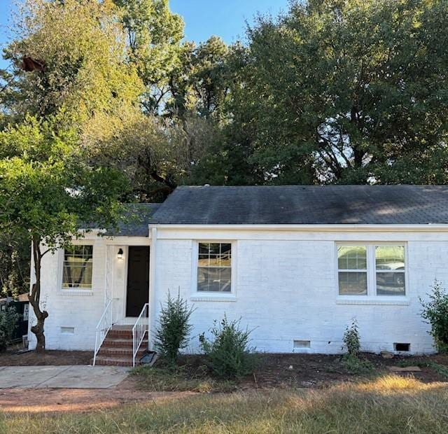 1764 Cahoon St, Atlanta, GA 30310 - view of front of house featuring crawl space, a shingled roof, and brick siding