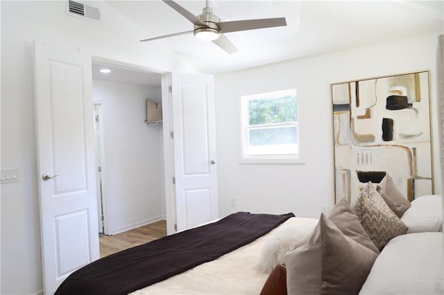 bedroom featuring light wood-type flooring and ceiling fan