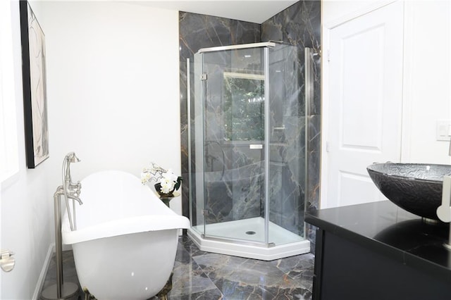 bathroom featuring vanity and separate shower and tub