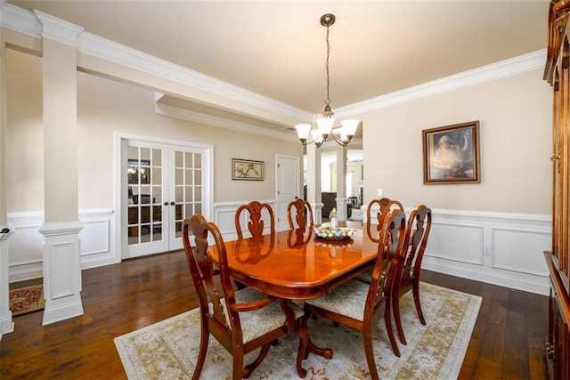 dining space with dark wood-style floors, french doors, a wainscoted wall, and ornamental molding