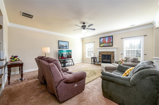 living room with visible vents, a healthy amount of sunlight, and crown molding