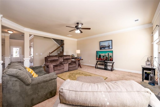 carpeted living room with visible vents, stairway, a fireplace, crown molding, and baseboards