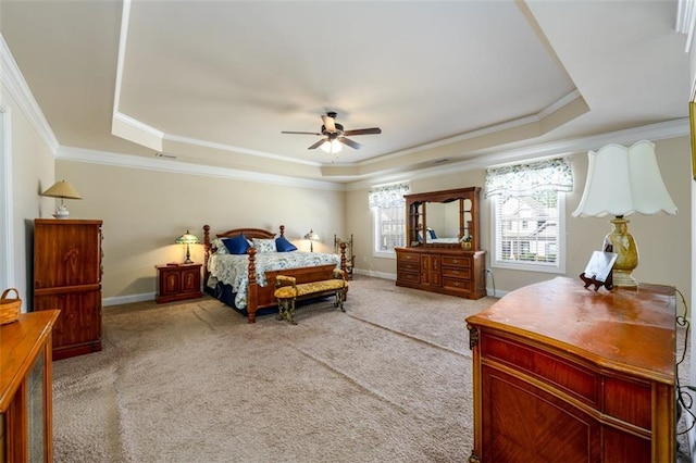 bedroom with light carpet, a raised ceiling, baseboards, and ornamental molding