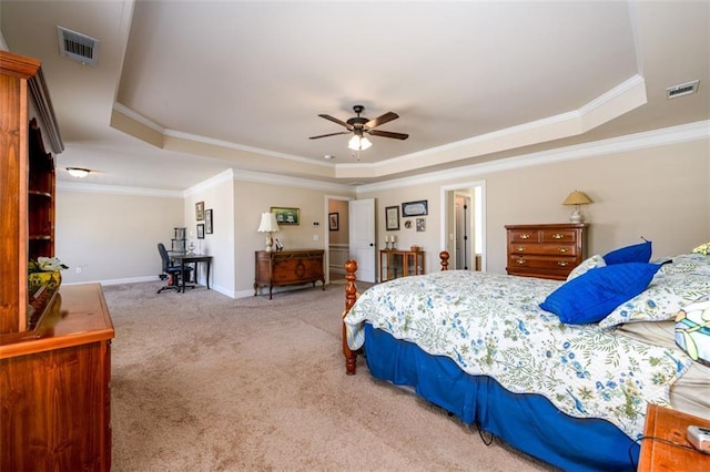 carpeted bedroom featuring visible vents, crown molding, a raised ceiling, and baseboards