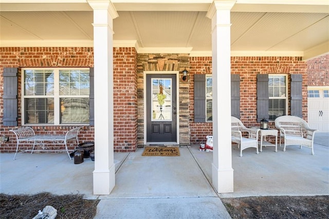 property entrance with brick siding and covered porch