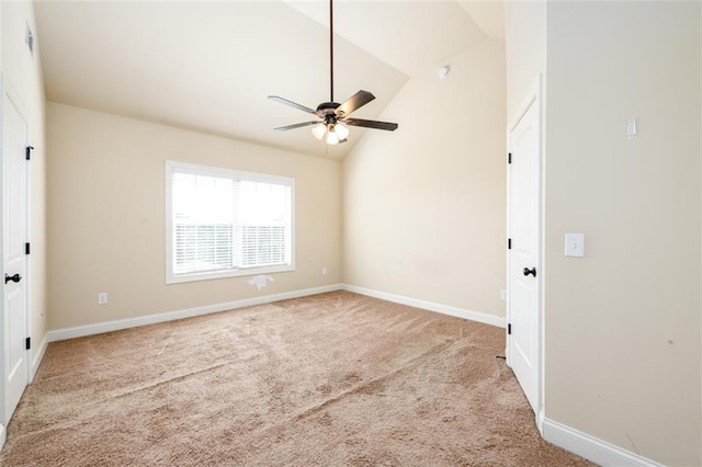 unfurnished room with vaulted ceiling, carpet, baseboards, and ceiling fan