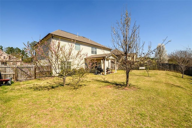 view of yard featuring a gazebo and a fenced backyard