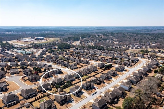 birds eye view of property with a residential view