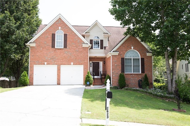 traditional-style home featuring brick siding, an attached garage, concrete driveway, and a front lawn