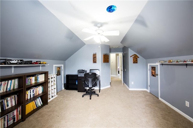 carpeted office with ceiling fan and vaulted ceiling