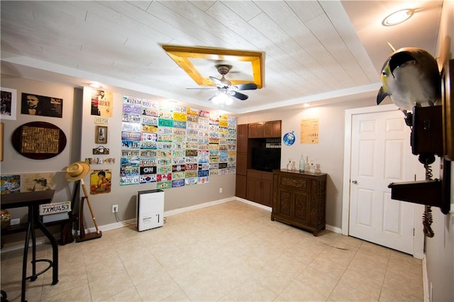 interior space featuring ceiling fan