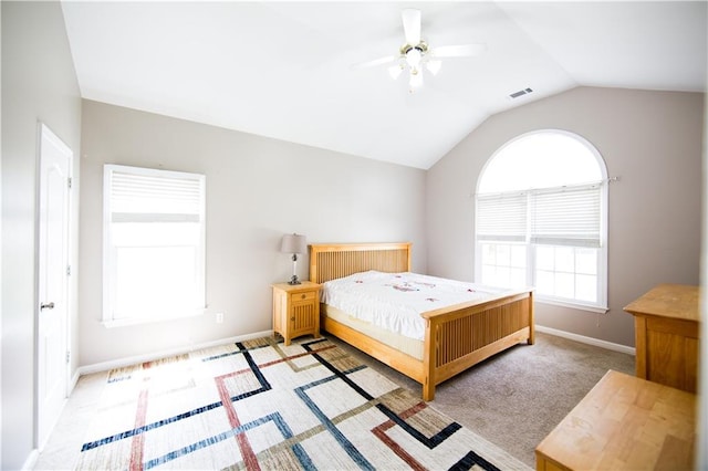 bedroom with light colored carpet, lofted ceiling, and ceiling fan